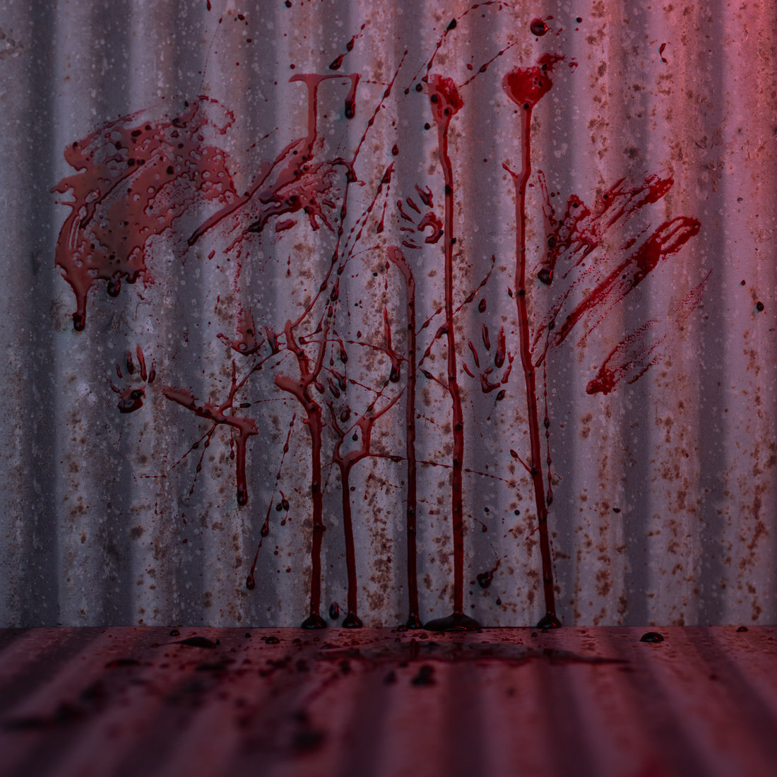 Photography set with corrugated metal, blood spatters, and red light