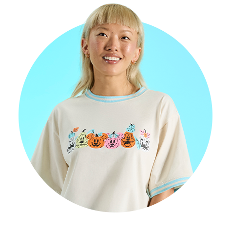 Circle-cropped photo with Blue background and model wearing Loungefly Mickey & Friends Halloween apparel