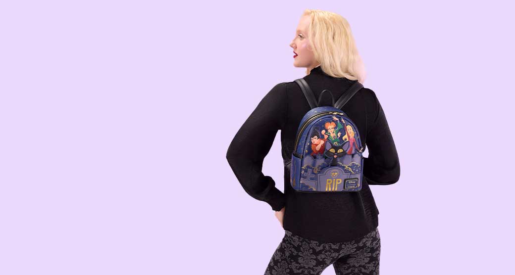 Light Blue background with model showcasing Loungefly Disney Mickey & Friends Halloween collection